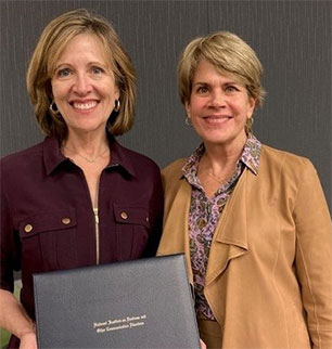 Kelley receives a commendation from NIDCD Director Debara L. Tucci, M.D., on September 14, 2023, for serving a three-year term on the NIH National Deafness and Other Communications Disorders (NIDCD) Advisory Council.