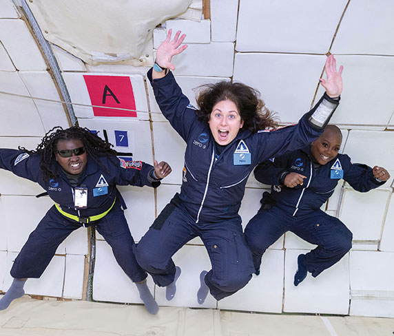 Denna Lambert, Victoria Garcia and K. Renee Horton, Ph.D., float during the AstroAccess parabolic space flight on Dec. 15, 2022.