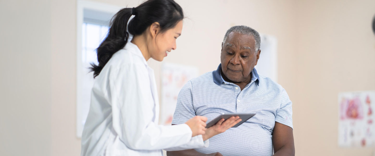 A older black man having his hearing checkup with audiologist
