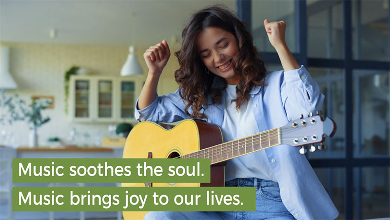 A woman playing the guitar