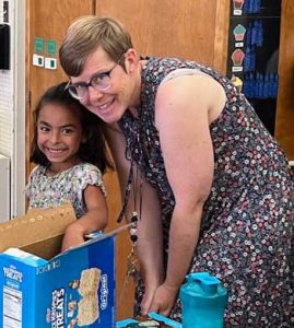 Olivia with her teacher