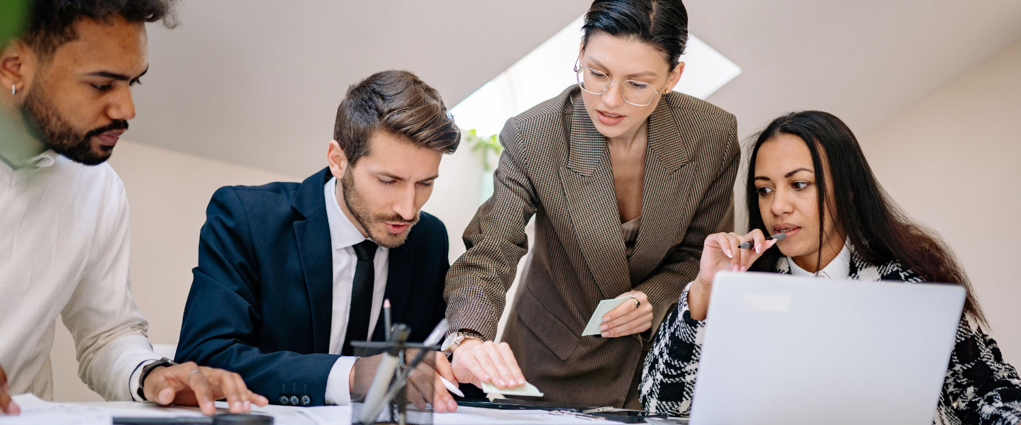 A group of people brainstorming at a desk