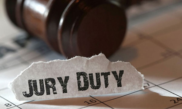 general-jury-duty-picture-600 Jury duty sign on table with a judge gavel.