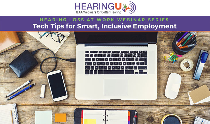 View looking down at an office desktop with a laptop and other office equipment.