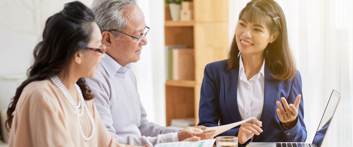 Older couple talking to financial advisor