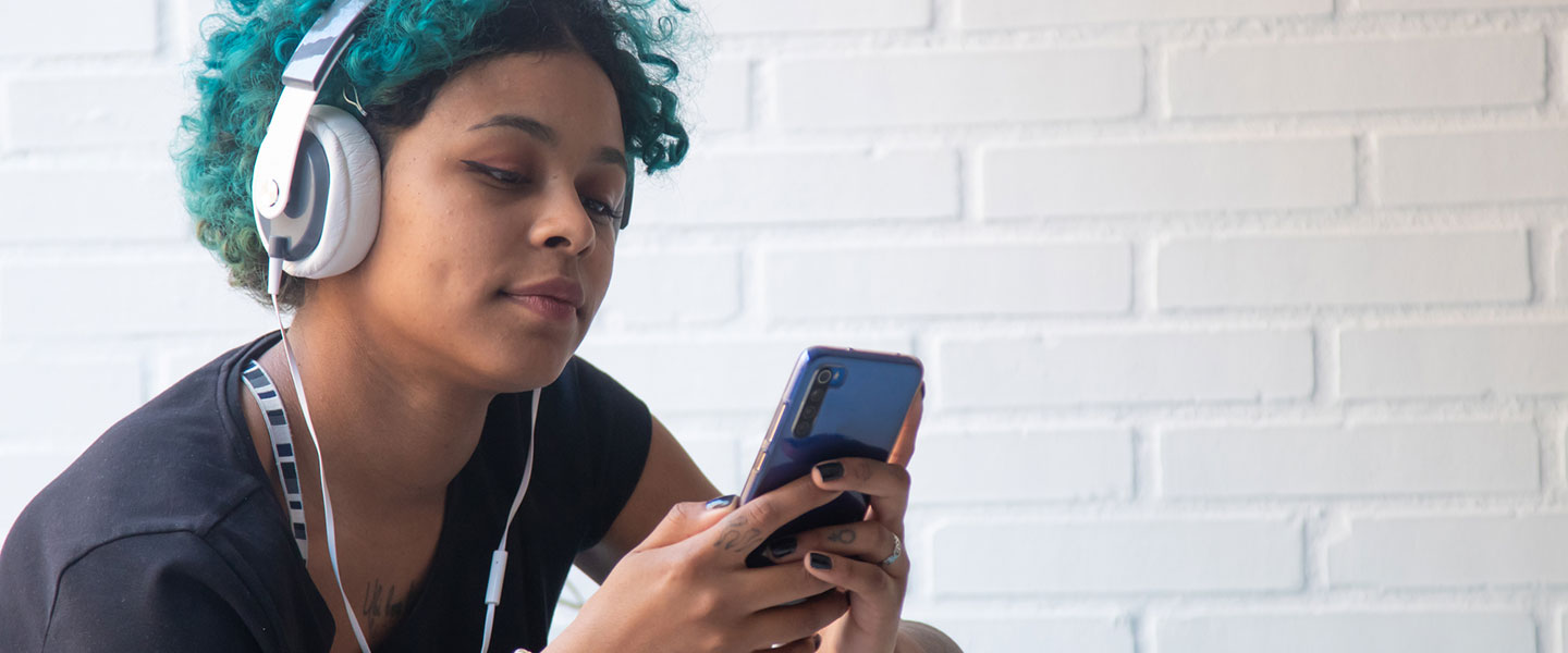 Young girl using her phone apps