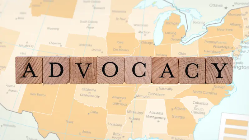 Advocacy letter blocks overlaying a map of the united states