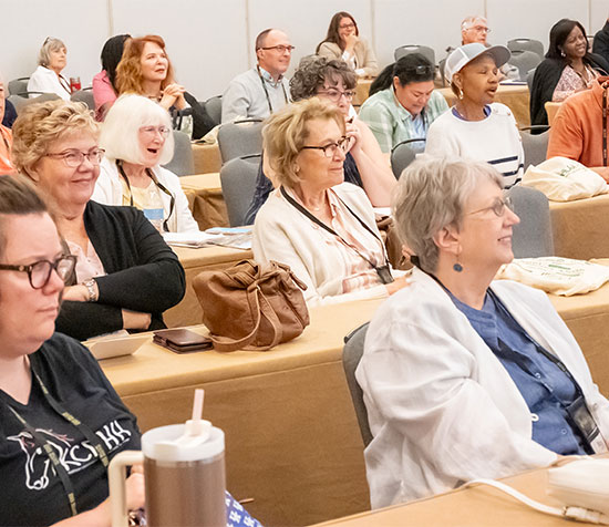 Group of convention participants attending a workshop.