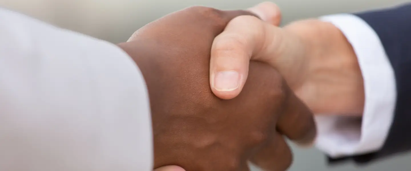 Close up of two people shaking hands