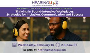 Two workers wearing hearing protection headphones in a warehouse.
