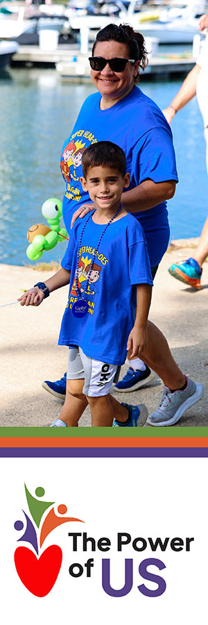A young woman with her son enjoying their local Walk4Hearing event.