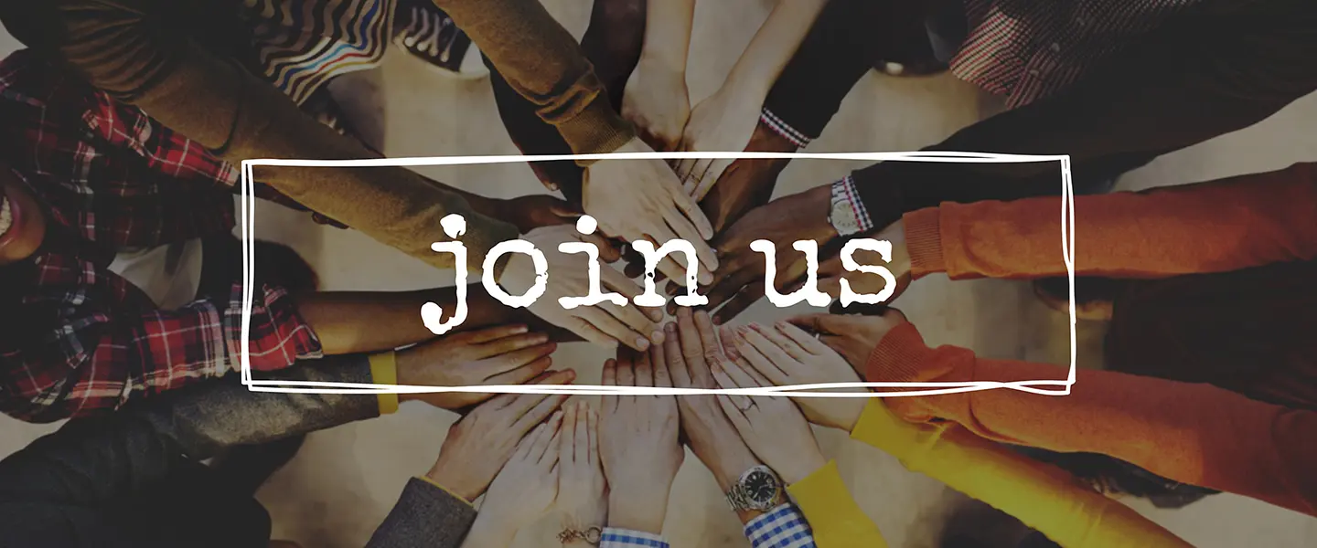 A group of hands touching each other in the center