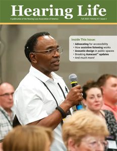 Cover image of Fall 2026 Hearing Life magazine of a black man with microphone participating in a discussion during the HLAA 2026 convention