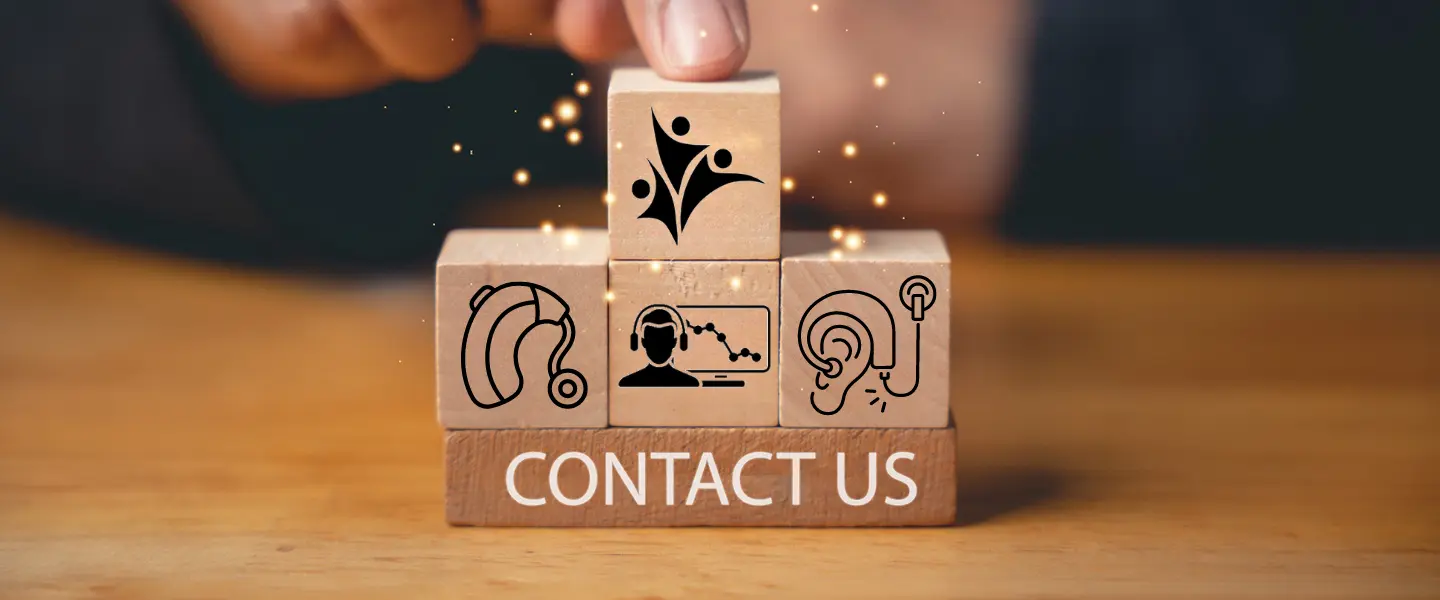 Wooden blocks of hearing loss symbols with contact us